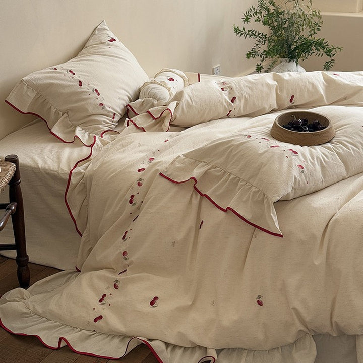 Bedding set with delicate cherry embroidery, ruffle and linen look