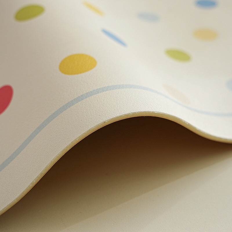 Oval wipeable placemat with pastel-colored polka dots Kalsten