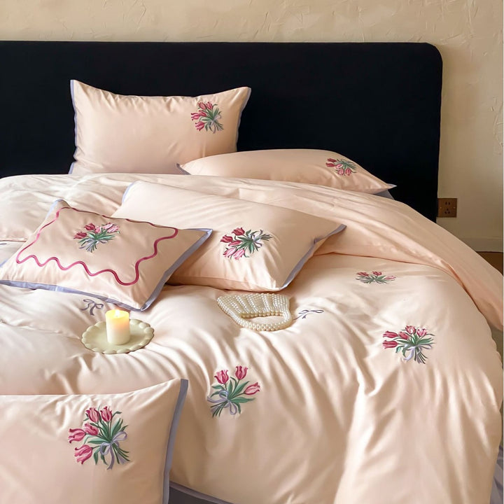 Fine cotton satin bedding set with embroidered tulip bouquets and contrasting piping