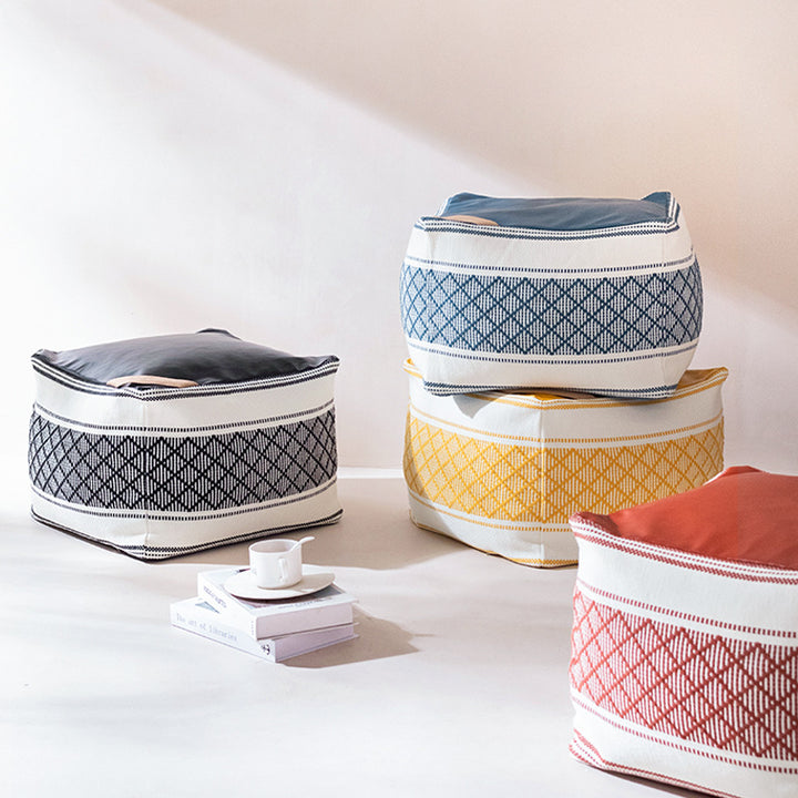 Woven seat pouf with quilted synthetic leather top and carry handle