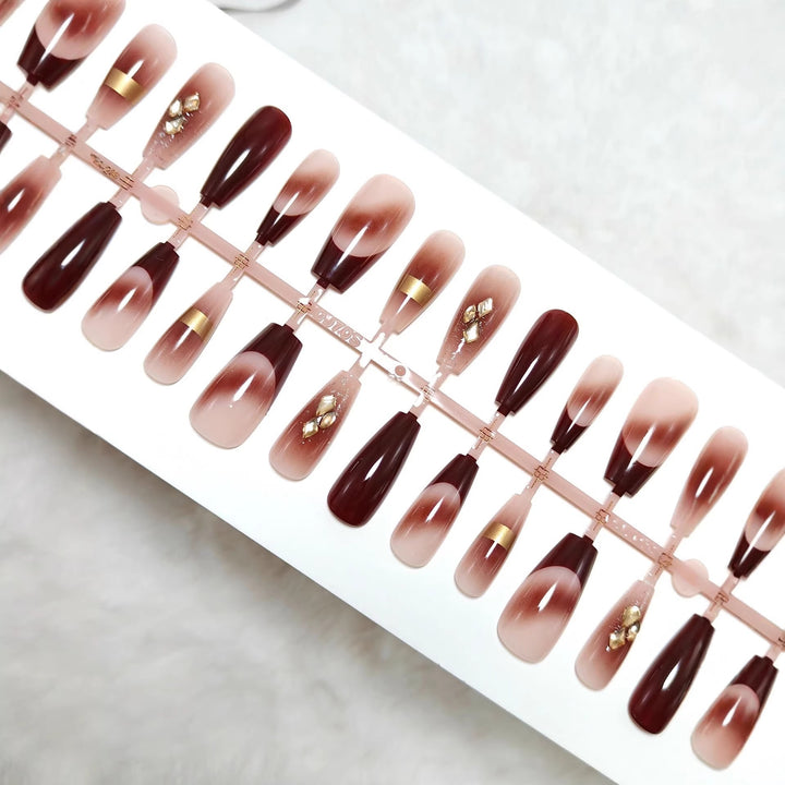 Artificial nails with elegant color gradients and jewelry details Kalsten