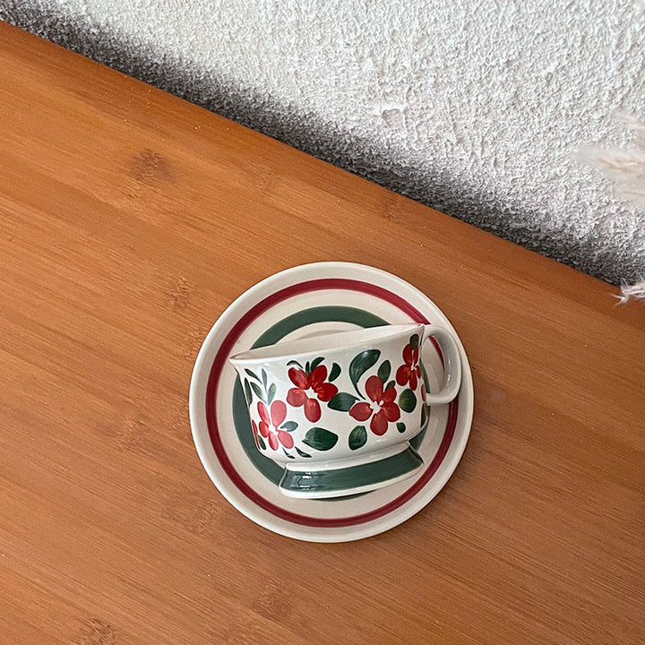 Ceramic coffee cup set with saucer and hand-painted leaf ornament
