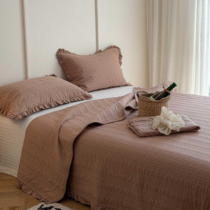 Quilted bedspread with frill and fine line quilting made of cotton blend fabric