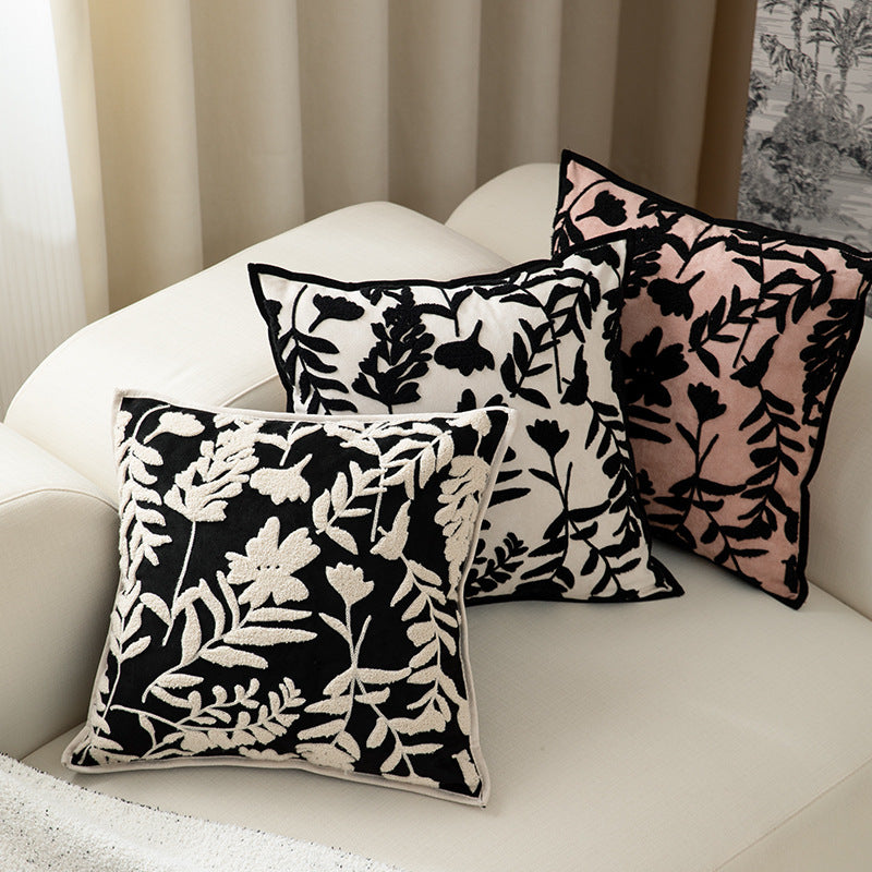 Square decorative pillow with floral flock embroidery and fine piping edge