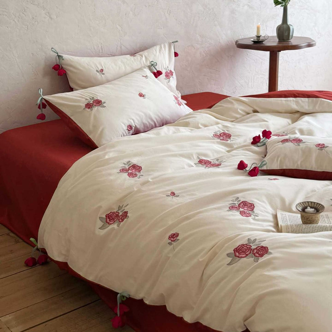Embroidered cotton bedding set with rose appliqués and tassels