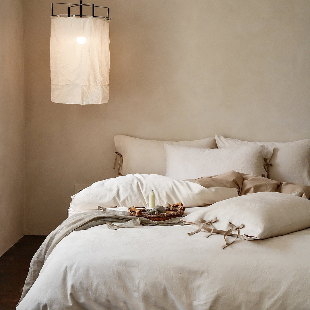 Fine cotton bedding set with jacquard floral pattern and side decorative ribbons