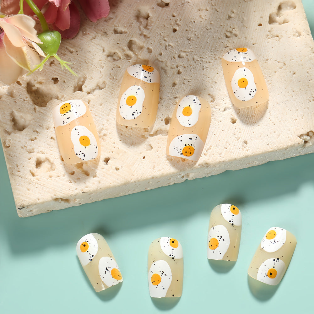 Artificial nails in creative fried egg design Kalsten