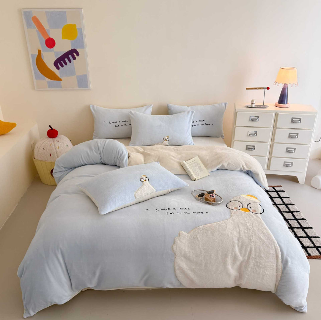 Cozy bedding set with embroidered rabbit appliqué and reversible cover