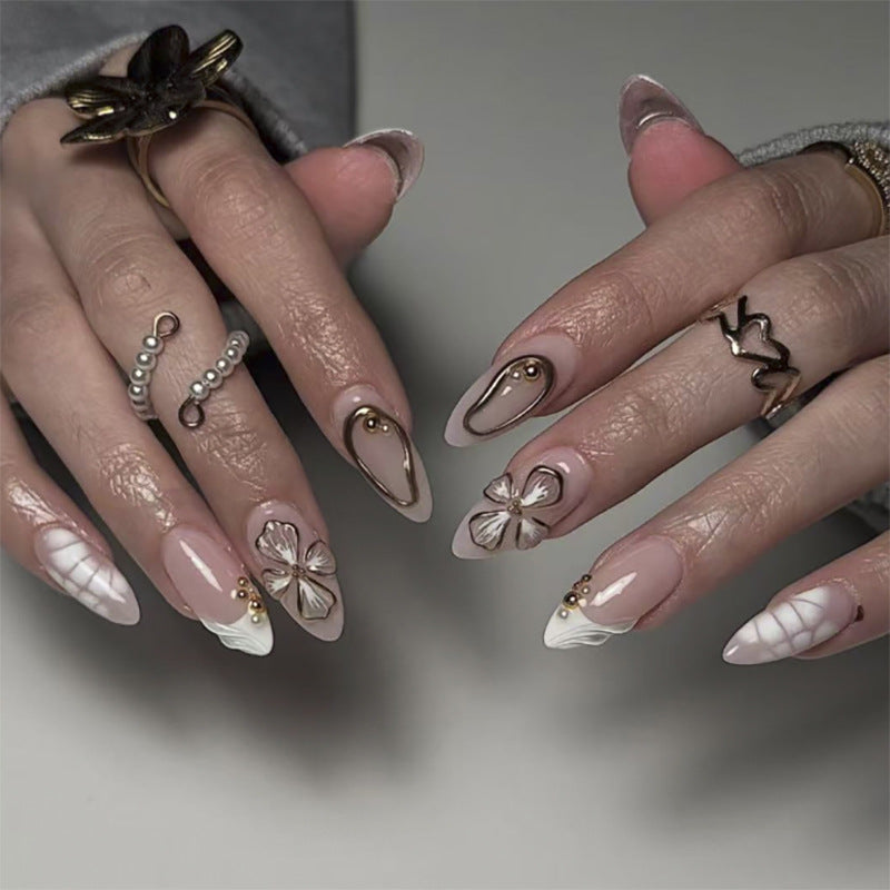 Artful stiletto nails with floral and shimmering decor Kalsten