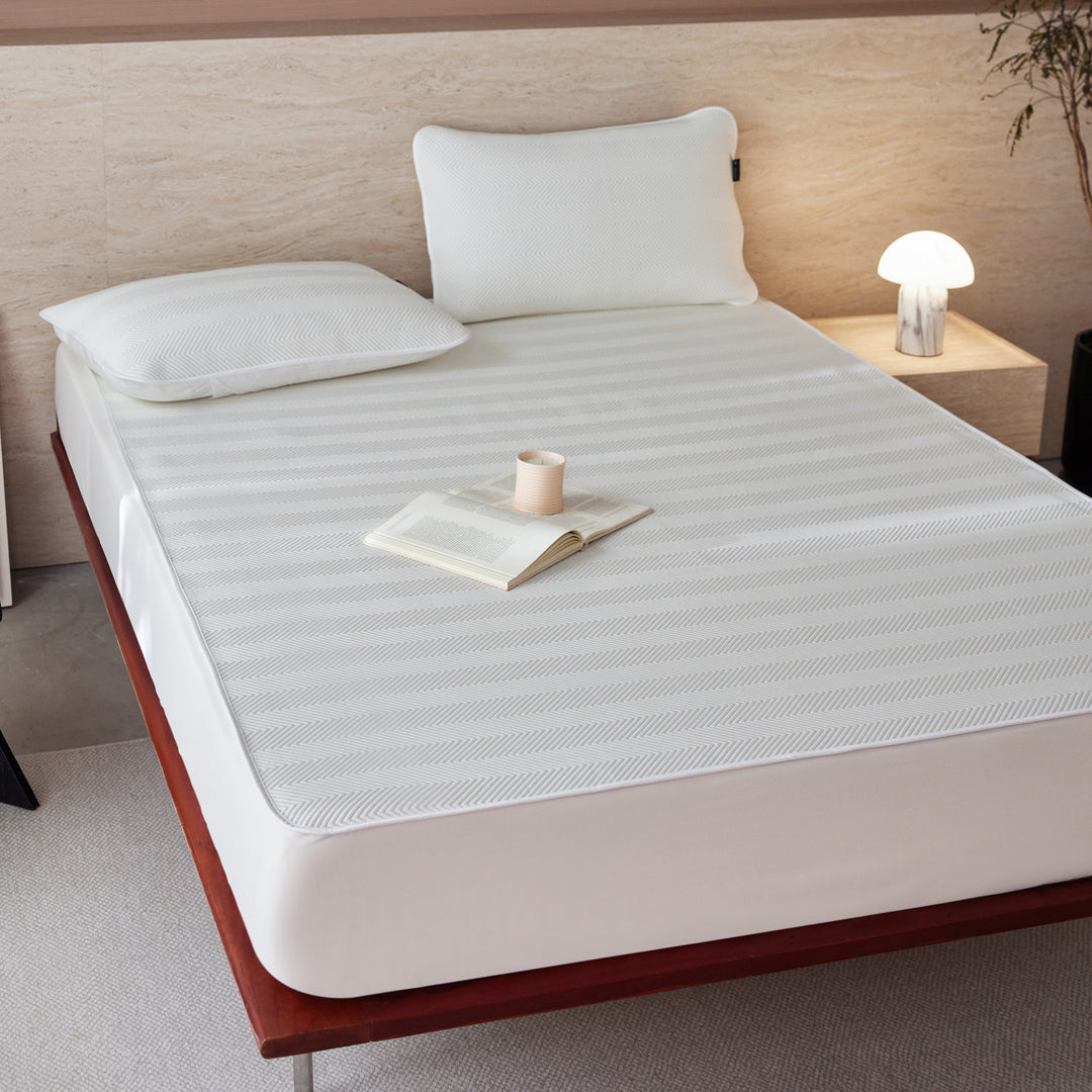 Breathable mattress topper with non-slip bottom and moisture-regulating structure