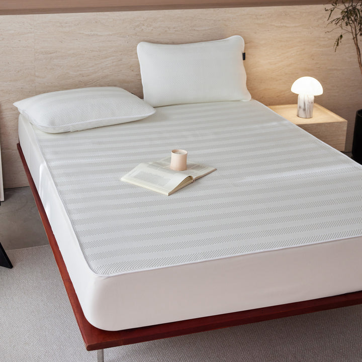 Breathable mattress topper with non-slip bottom and moisture-regulating structure
