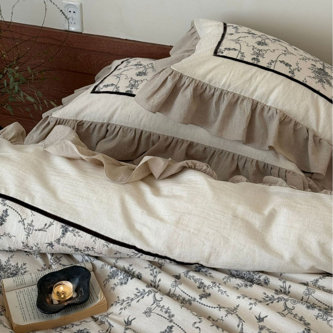 Romantic linen-look bedding set with ruffle, quilted center panel, and fine floral jacquard