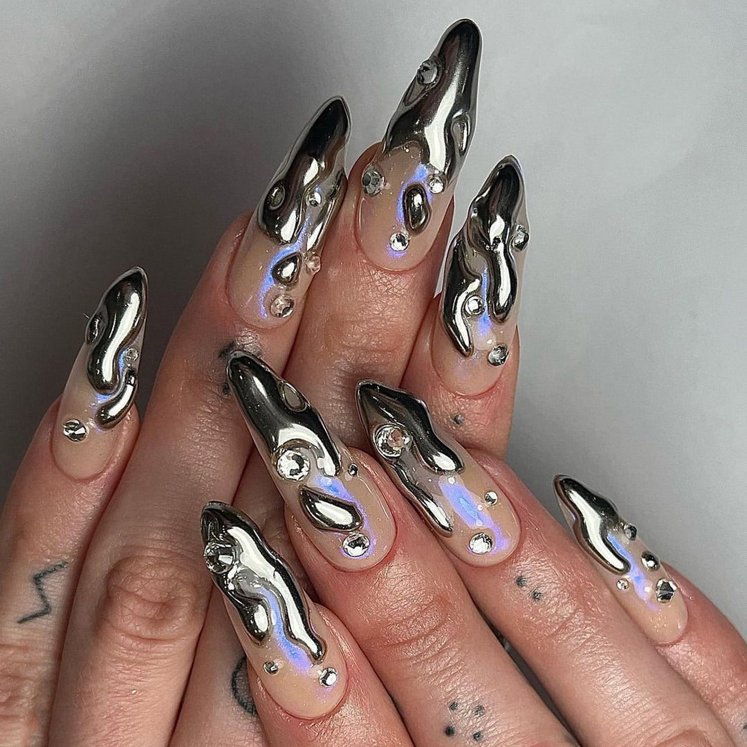 Artful artificial nails with glitter and metallic accents Kalsten