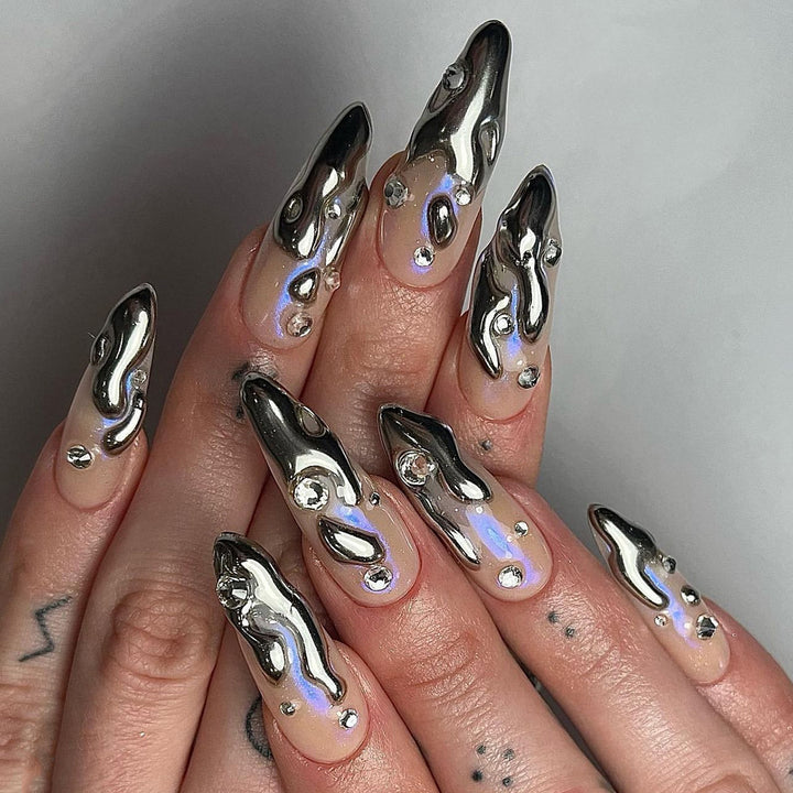 Artful artificial nails with glitter and metallic accents Kalsten