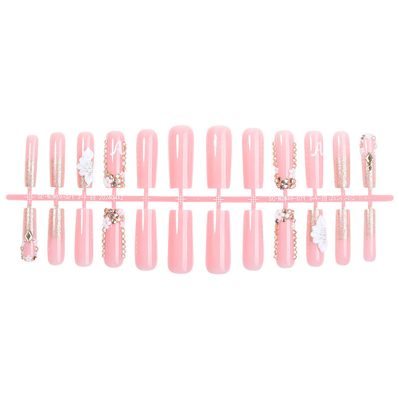 Creative acrylic nail set with delicate flower and gloss embellishments Kalsten