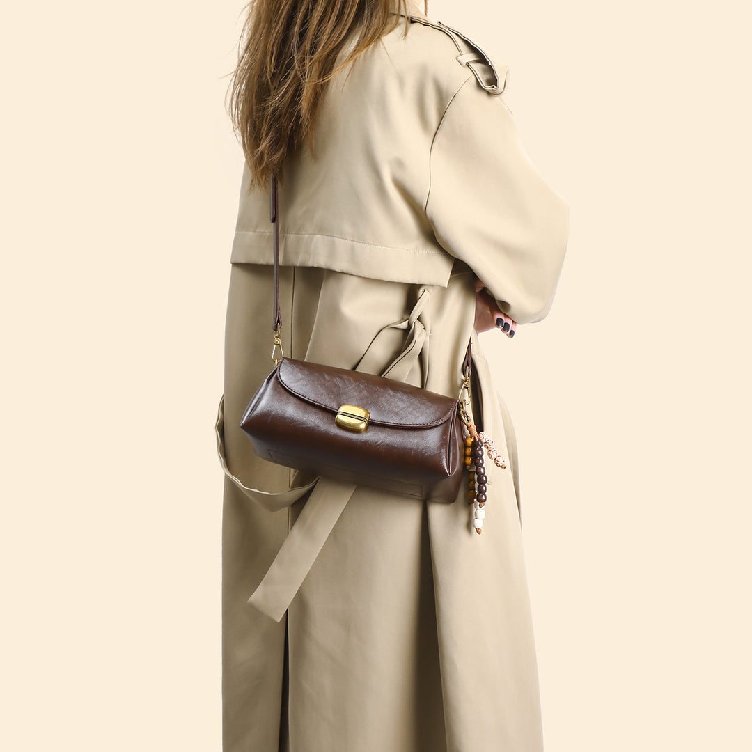 Elegant Handheld Shoulder Bag with Decorative Beaded Charm