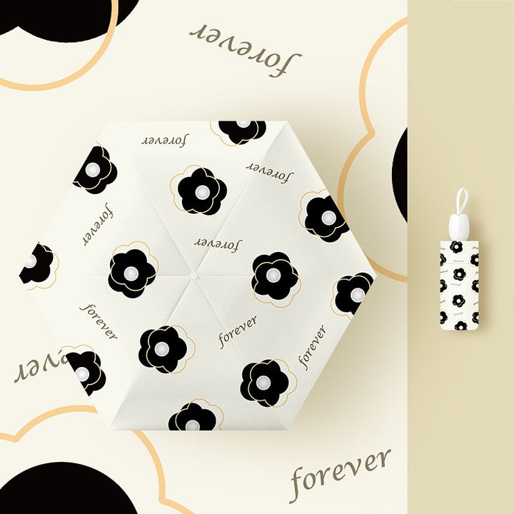 Ladies folding umbrella with playful flower design Kalsten