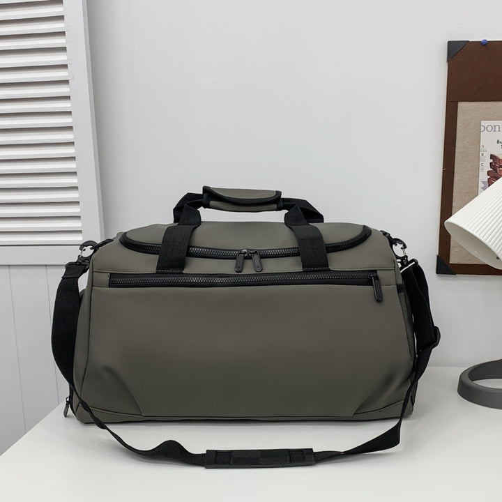Sporty travel bag with reinforced carrying handles and multiple compartments Kalsten