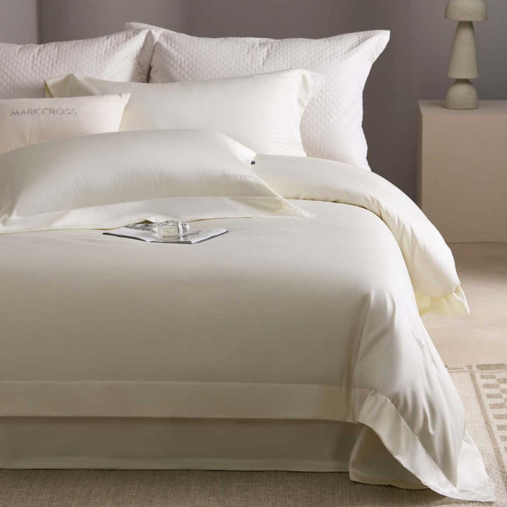 Luxurious cotton satin bedding set with delicate lace trim and hotel finish