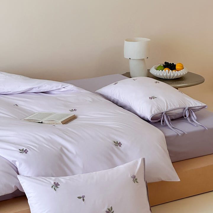 Reversible cotton bedding set with fine check pattern, cherry embroidery, and decorative tie ribbons