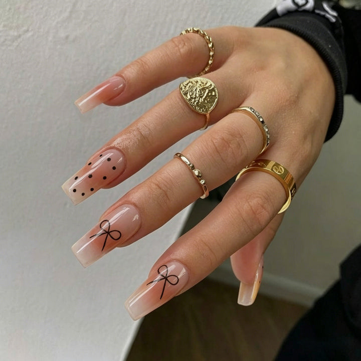 Artificial nails with modern dot design and elegant accents Kalsten