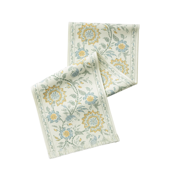 Table runner made of woven cotton blend with floral border