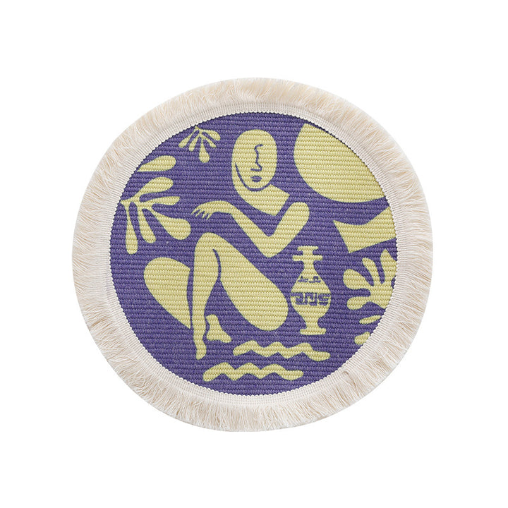Round woven placemat with fringes and abstract figure motif Kalsten