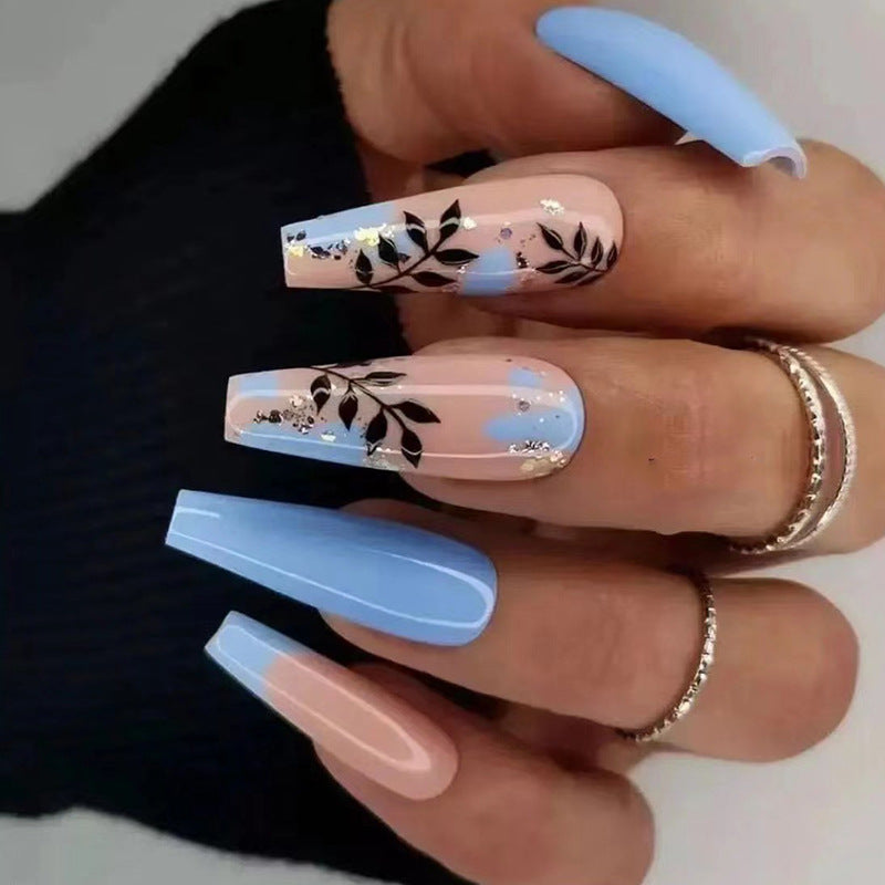 Artful Nail Art with Floral Designs and Glitter Kalsten