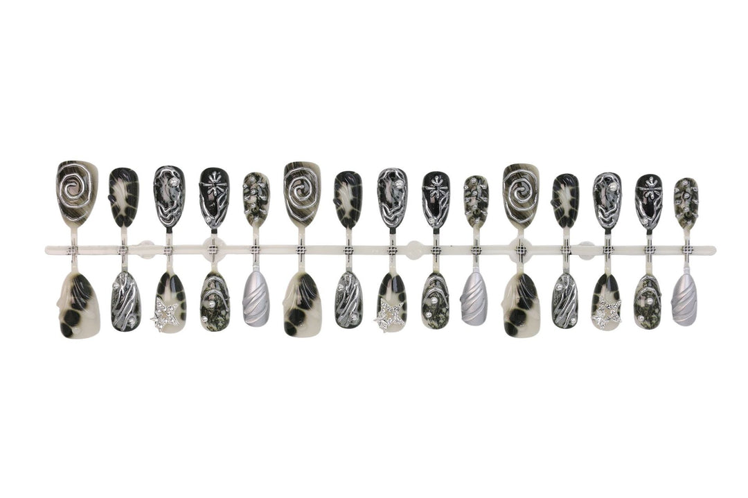 Art nail set with artistic patterns and glitter accents Kalsten