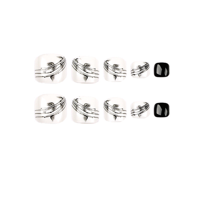 Artful toenail art in elegant black and white design Kalsten
