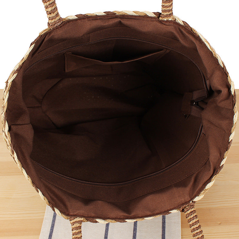 Fashionable basket bag with decorative pompons Kalsten