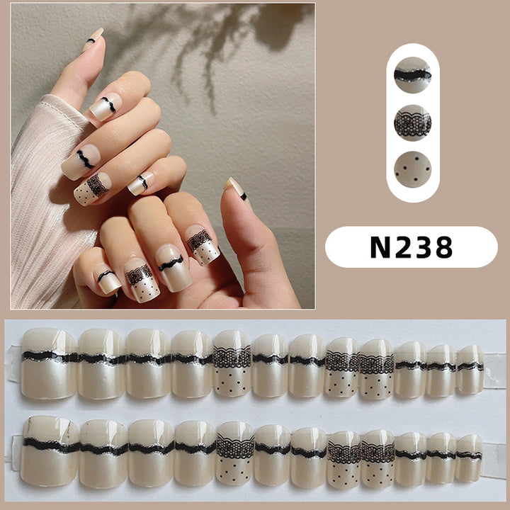 Artistic Press-On Nail Design with Lace and Polka Dots