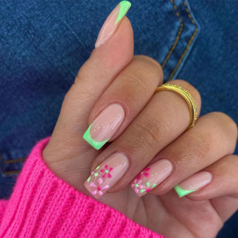 Artificial nails with floral accents and neon tips Kalsten