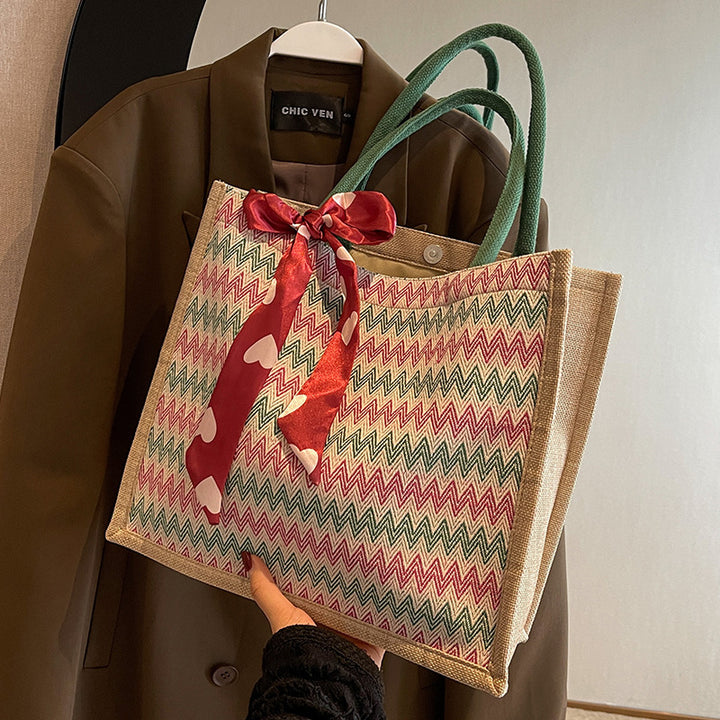 Textured Handbag with Decorative Bow