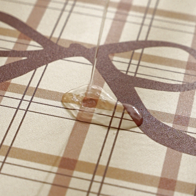 Rectangular wipeable placemat with checked pattern, wavy decorative edge and bow motif Kalsten