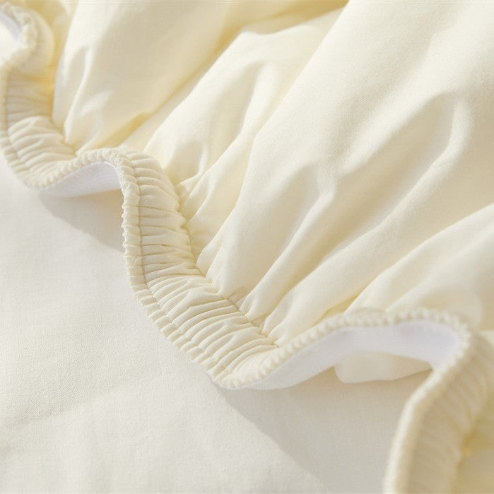 Breathable climate-regulating topper with hollow fiber filling and elastic all-round rubber
