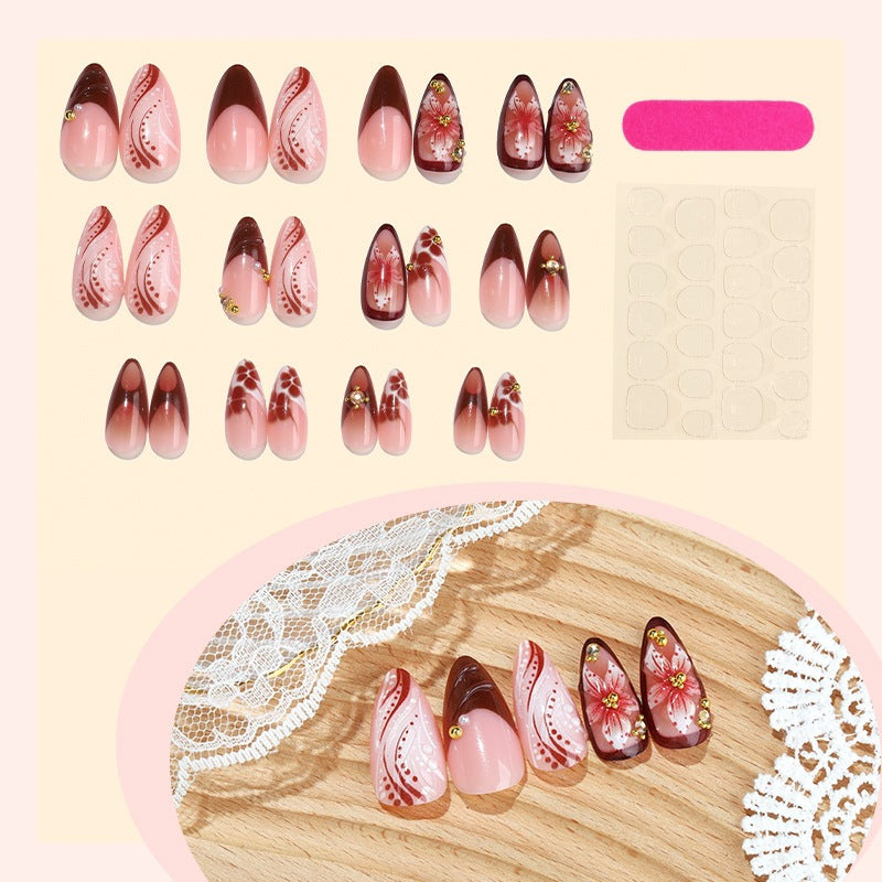 Acrylic nail set with elegant 3D flower accents and glamorous designs Kalsten
