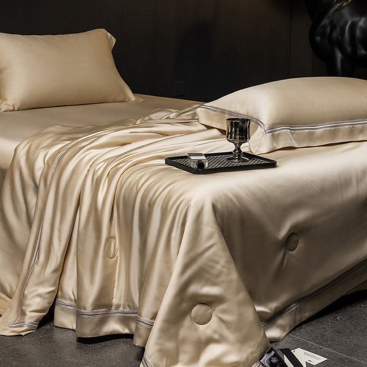 Luxurious satin bed set with silk-like surface and fine decorative stitching