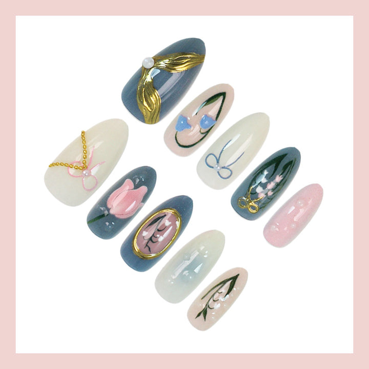 Acrylic nail set with floral design and elegant gold embellishments Kalsten