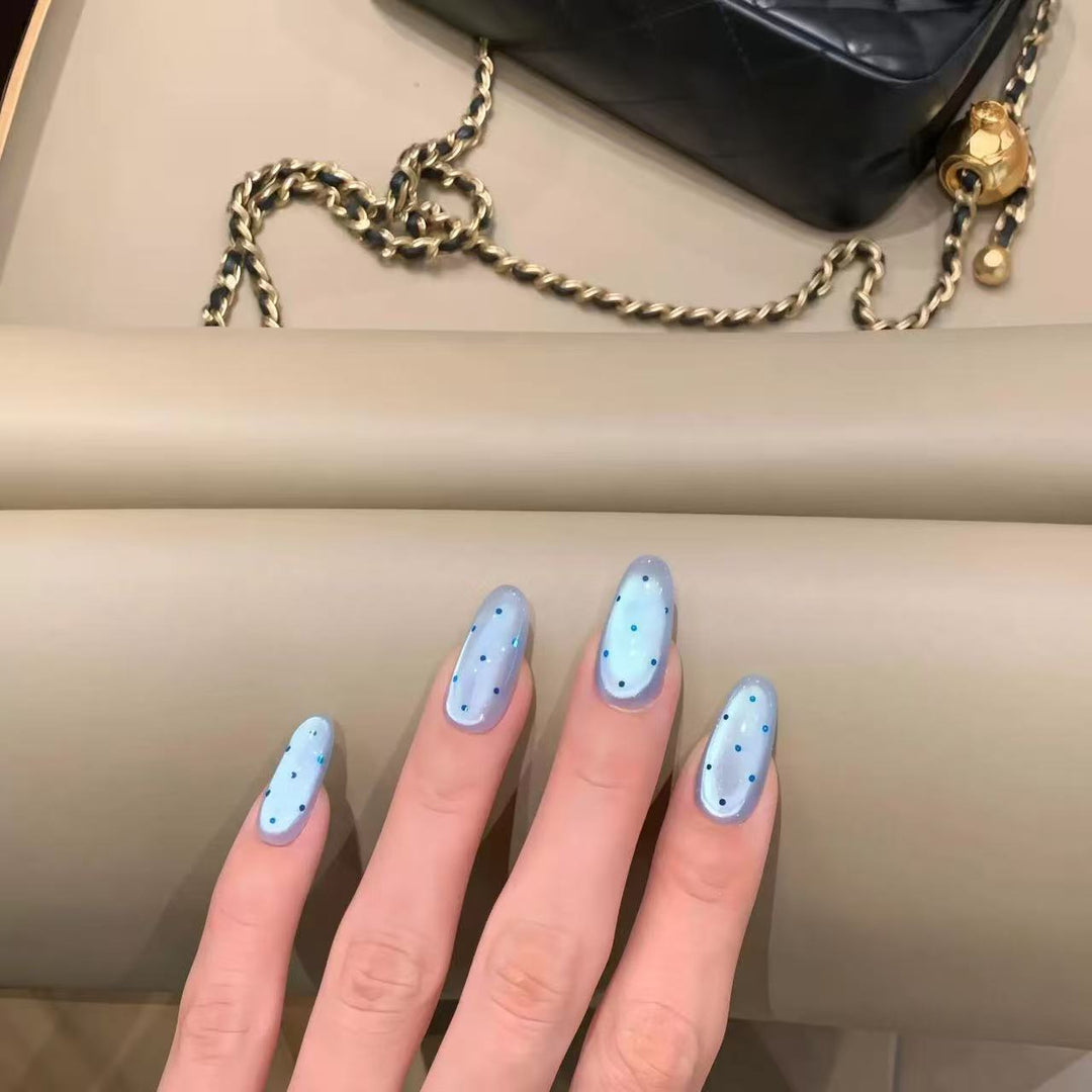 Elegant Stiletto Nail Extensions with Decorative Accents