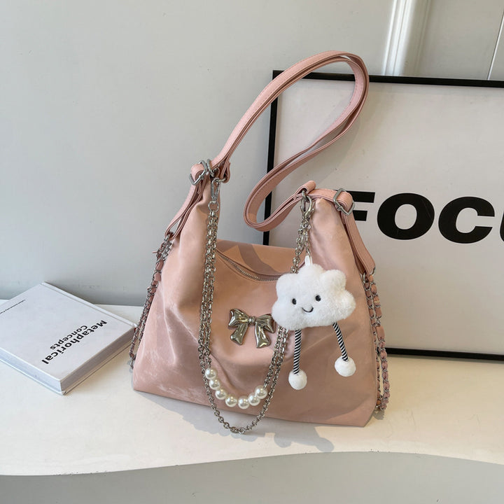 Fashionable handbag with unique pendant and chain accents Kalsten
