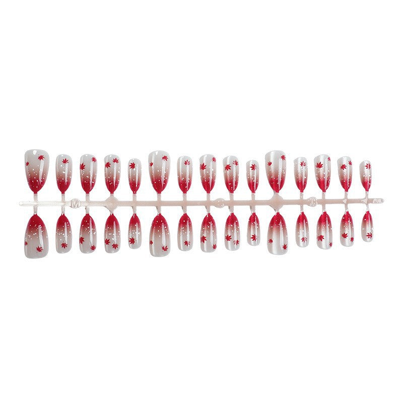 Art nail set with elegant red ombré look and delicate maple leaves Kalsten