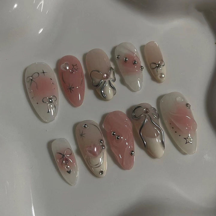Artistic Nail Tips with Glitter and Bow Motifs Kalsten