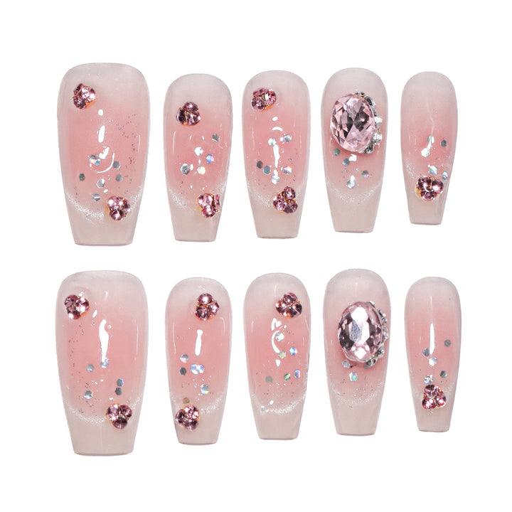 Artificial nail extensions with artistic glitter accents Kalsten