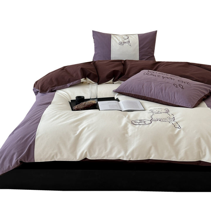 Reversible bedding set with contrasting inserts and fine line embroidery