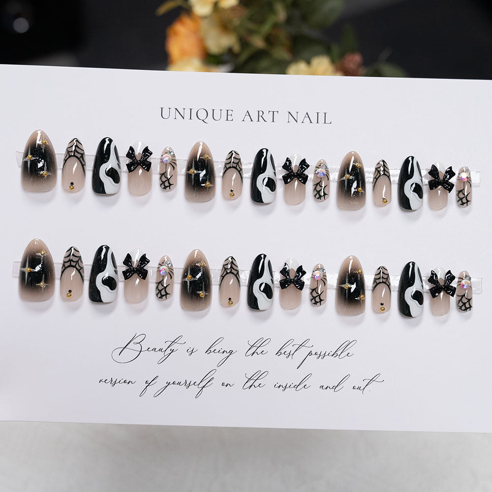 Artistic Press-On Nail Set with Unique Black and White Design