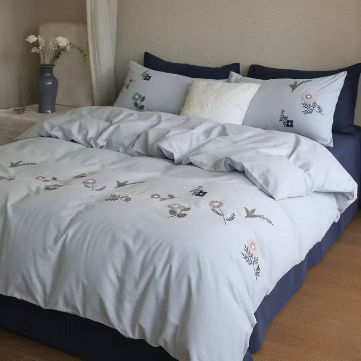 Embroidered cotton bedding set with delicate wildflower embroidery and percale texture