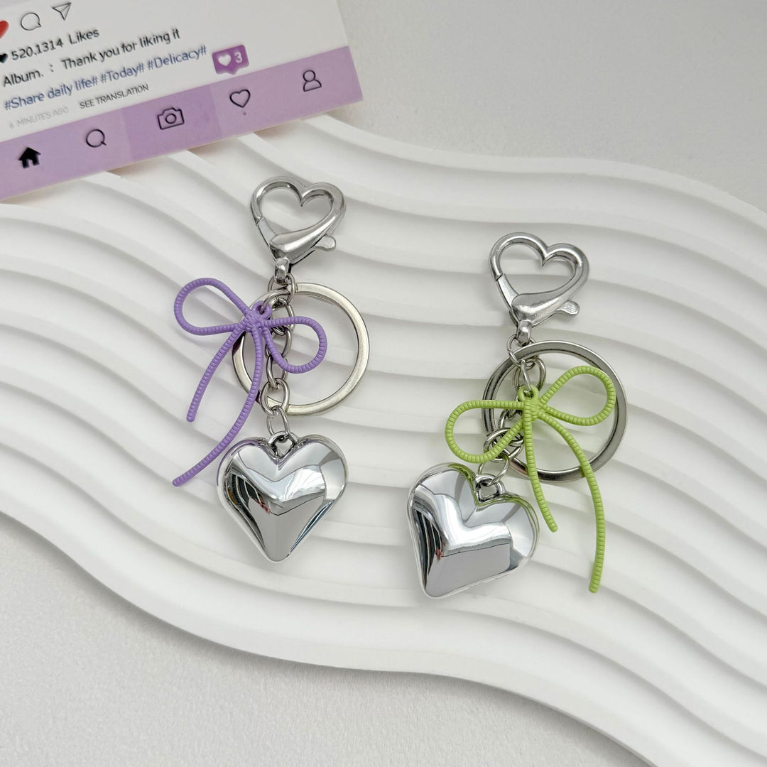 Heart-Shaped Metallic Keychain with Decorative Bow Kalsten