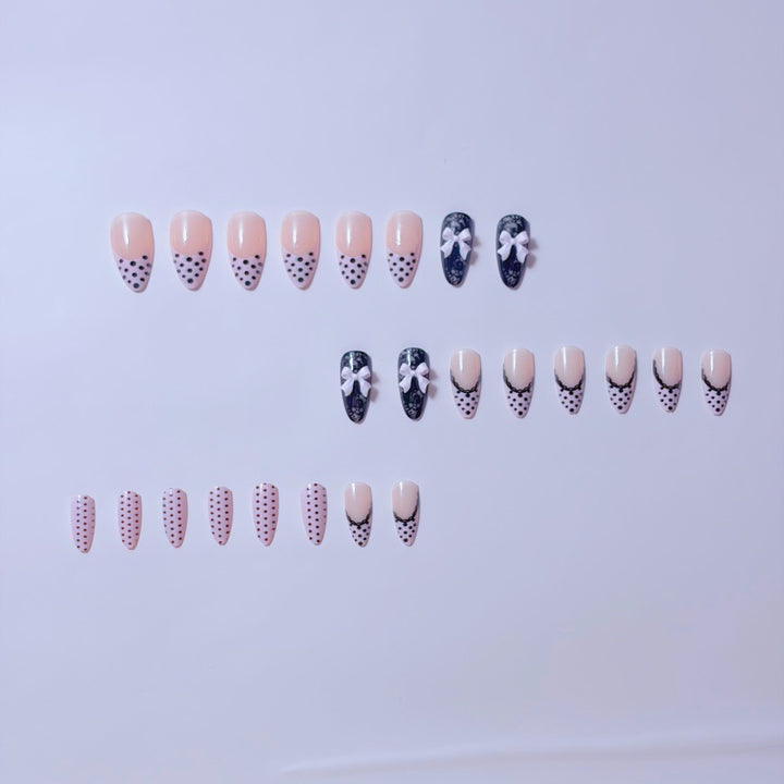 Elegant artificial nails with lace design and bow accents Kalsten