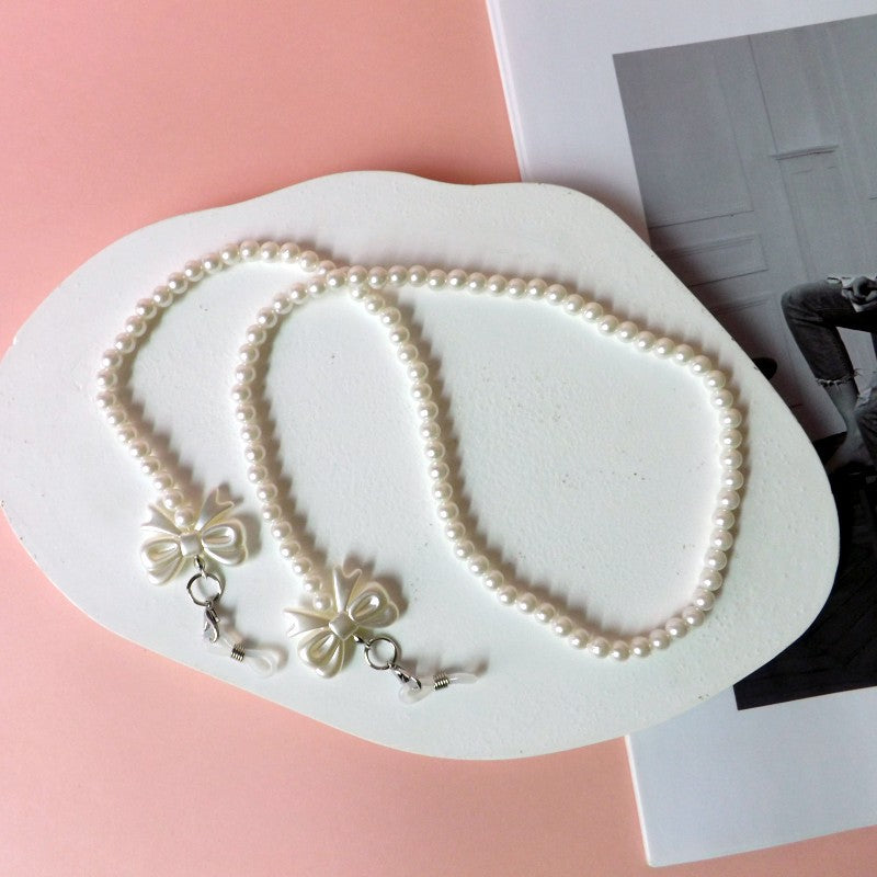 Elegant pearl glasses chain with bow pendants Kalsten